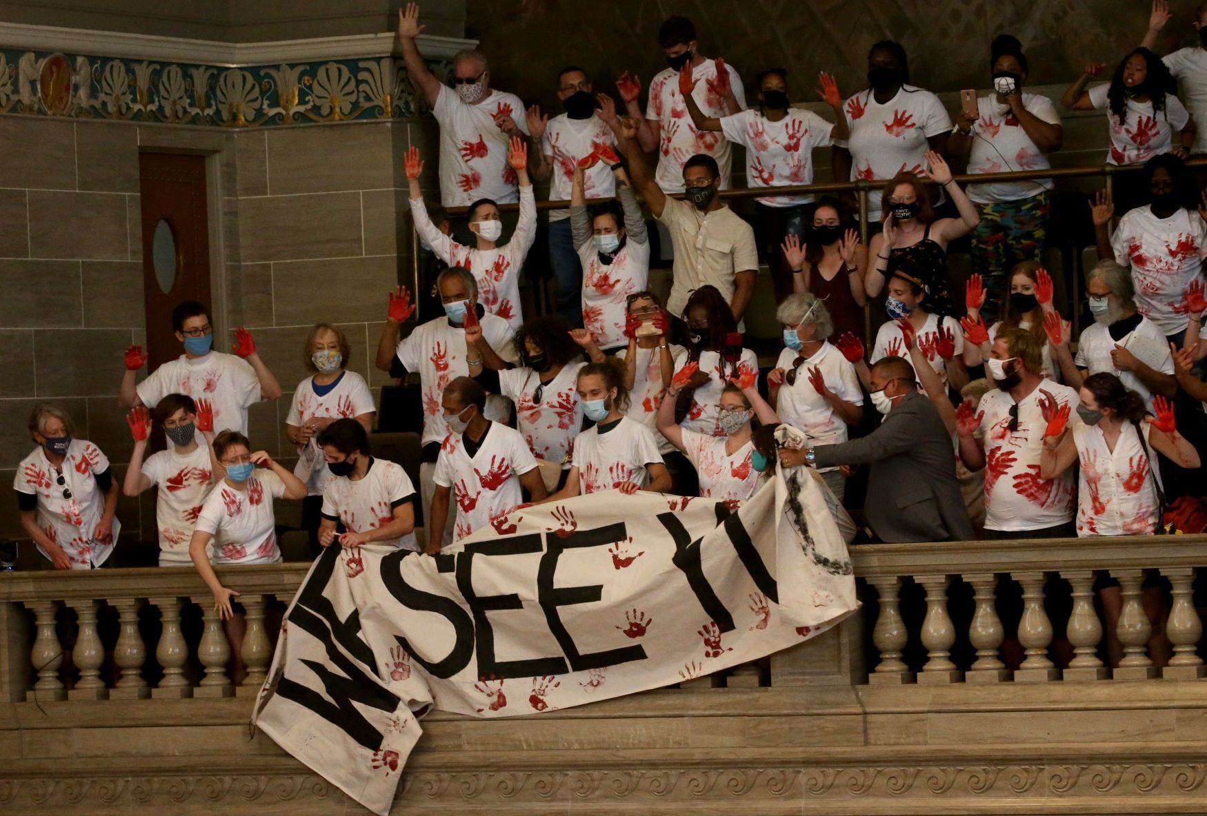 ExpectUsSTL protesters drop poster during House debate